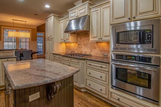 Clean, modern kitchen with granite counter top.
